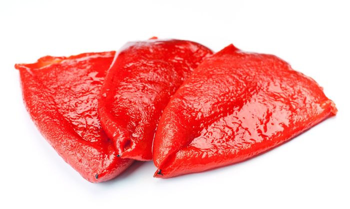 15997377 – red peppers, roasted and peeled, isolated on white